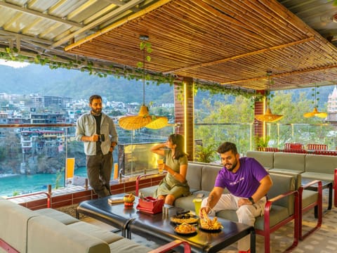 Patio, Restaurant/places to eat, Day, People, Natural landscape, View (from property/room), Living room, Food, group of guests