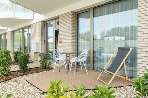 Property building, Patio, Spring, Day, Garden, View (from property/room), Balcony/Terrace, Garden view, sunbed