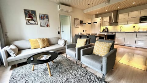 Living room, Seating area, Dining area, dishwasher, microwave, kitchen, air conditioner