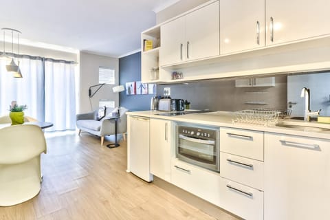 Kitchen or kitchenette, Living room, Seating area, oven, stove, toaster