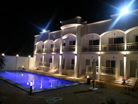 Property building, Night, Pool view, Swimming pool