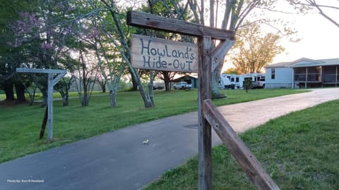 Facade/entrance, Property logo or sign, Natural landscape, Garden, View (from property/room), Sunset, Parking