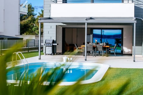 Property building, Patio, Day, BBQ facilities, Pool view, Swimming pool