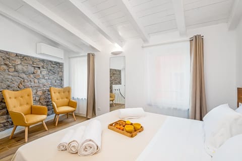 Bed, Living room, Seating area, Bedroom
