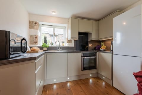 Kitchen or kitchenette, dishwasher, oven, stove, toaster