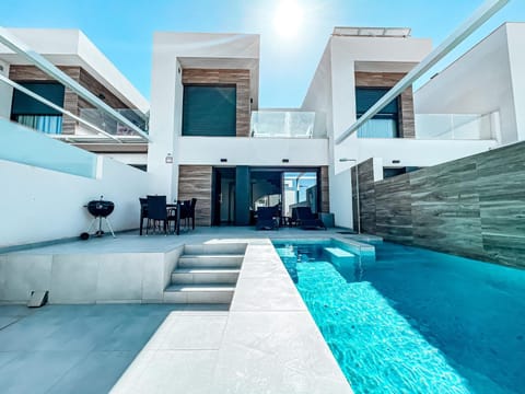 Property building, Patio, BBQ facilities, View (from property/room), Balcony/Terrace, Pool view, Swimming pool, sunbed