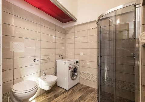 Shower, Toilet, Bathroom, bidet, towels, washing machine, dryer