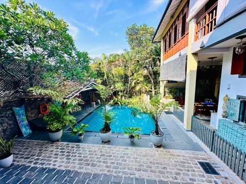 Property building, Patio, Day, Garden, Pool view, Swimming pool