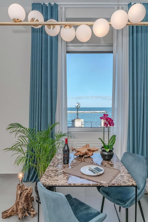 View (from property/room), Living room, Seating area, Dining area, Sea view