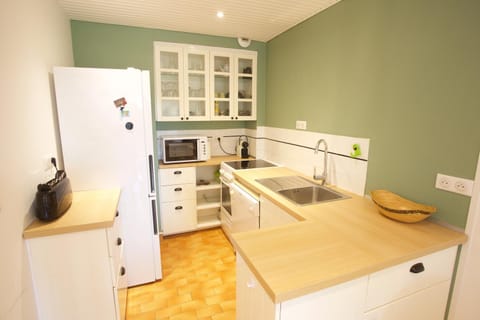 Kitchen or kitchenette, dishwasher, oven, stove, toaster