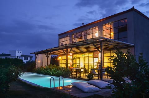 Property building, Night, Pool view, Swimming pool, sunbed