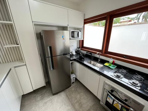 Kitchen or kitchenette, dishwasher, oven, stove