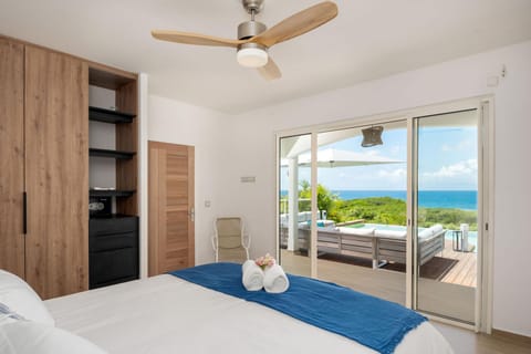 Bed, Natural landscape, View (from property/room), Photo of the whole room, Beach, Bedroom, Garden view, Pool view, Sea view, fireplace, safe, storage, towels, wardrobe, air conditioner