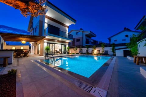 Property building, Patio, Night, Pool view, Swimming pool, sunbed