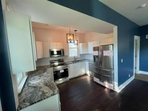 Kitchen or kitchenette, dishwasher, oven, stove