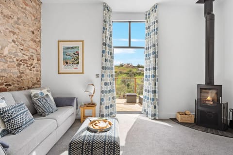 Property building, View (from property/room), Living room, Seating area, Garden view, fireplace