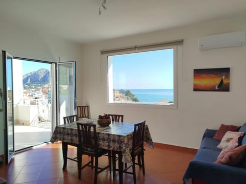 View (from property/room), Living room, Seating area, Dining area, Sea view