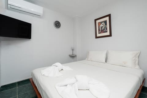 Bed, TV and multimedia, Bedroom, towels, air conditioner