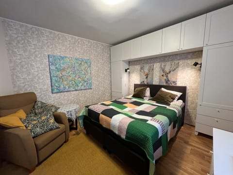 Bed, Living room, Seating area, Bedroom