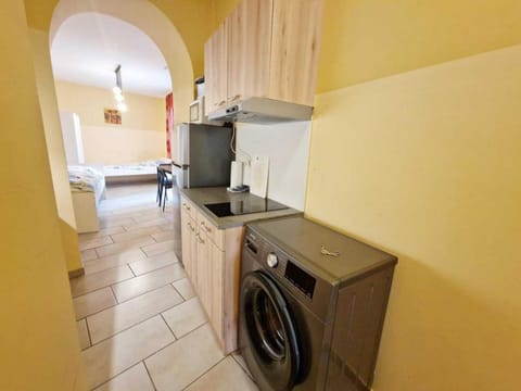 Kitchen or kitchenette, stove, washing machine