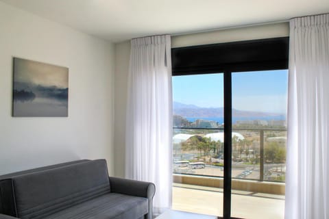 View (from property/room), Balcony/Terrace, Living room, Seating area, City view, Mountain view, Sea view