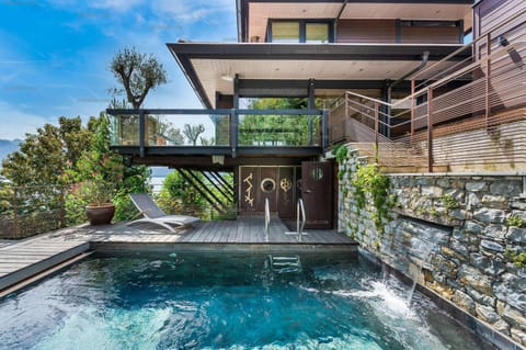 Property building, Patio, Day, Natural landscape, Garden, Garden view, Pool view, Swimming pool