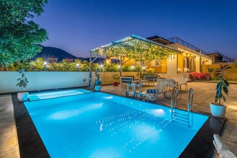 Property building, Patio, Night, Pool view, Swimming pool, sunbed