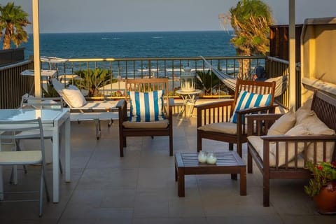 Natural landscape, View (from property/room), Balcony/Terrace, Living room, Seating area, Beach, Sea view, sunbed