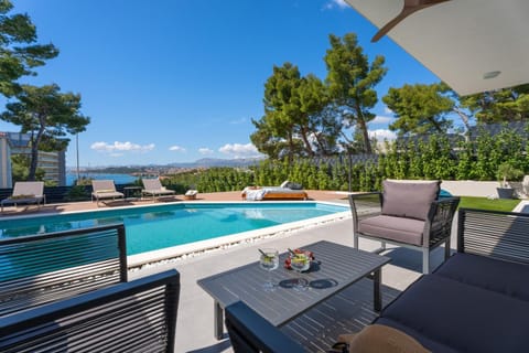 Toilet, Bathroom, Balcony/Terrace, Seating area, Pool view, Swimming pool