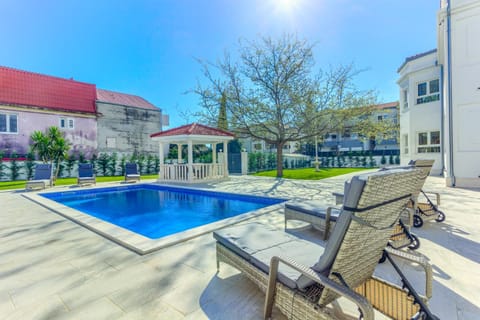 Patio, Pool view, Swimming pool, sunbed