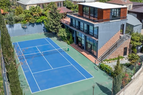 Property building, Day, Tennis court, Swimming pool