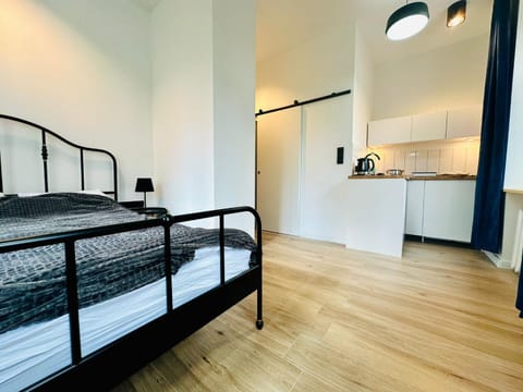 Bed, dishwasher, kitchen