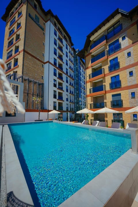 Property building, Pool view, Swimming pool, sunbed