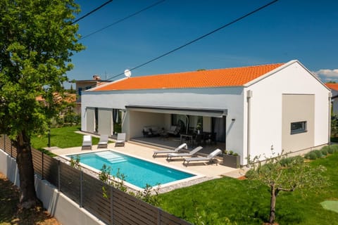 Property building, Patio, Spring, Day, Garden, View (from property/room), Garden view, Pool view, Swimming pool, sunbed