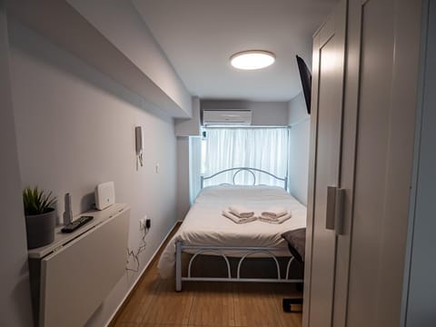 Bed, Photo of the whole room, Decorative detail, Bedroom, towels, wardrobe, air conditioner