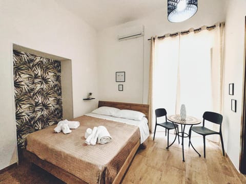 Bed, Living room, Photo of the whole room, Seating area, Bedroom, towels, air conditioner