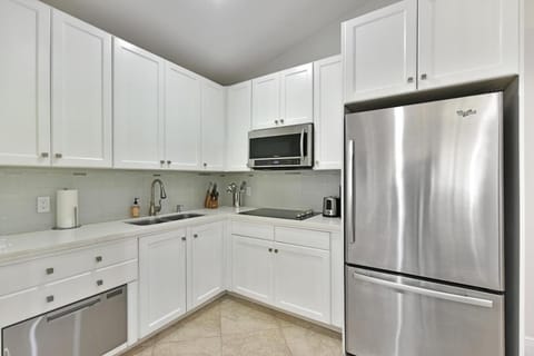 Kitchen or kitchenette, dishwasher, stove, toaster