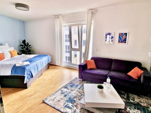 Bed, TV and multimedia, Living room, Seating area, Bedroom