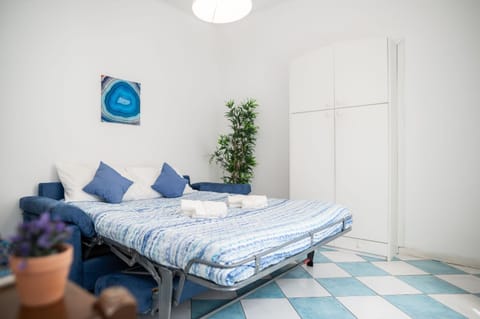 Bed, towels, wardrobe