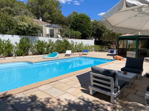 Property building, Patio, Pool view, Swimming pool, sunbed