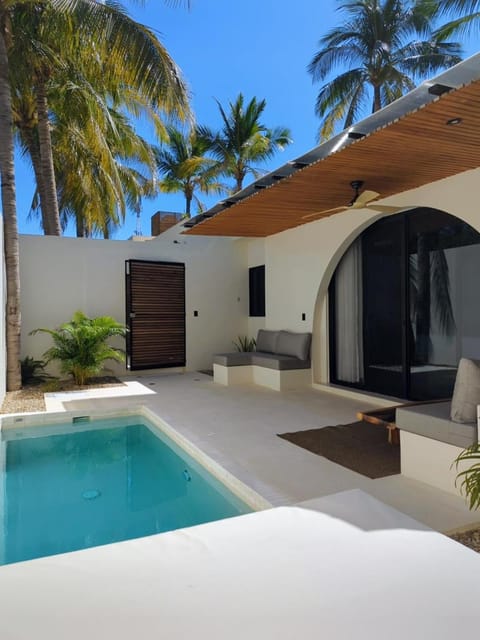 Patio, Living room, Seating area, Pool view, Swimming pool