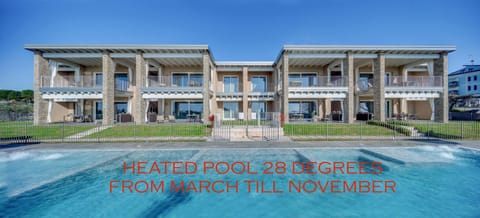 Property building, Day, Text overlay, Pool view, Swimming pool