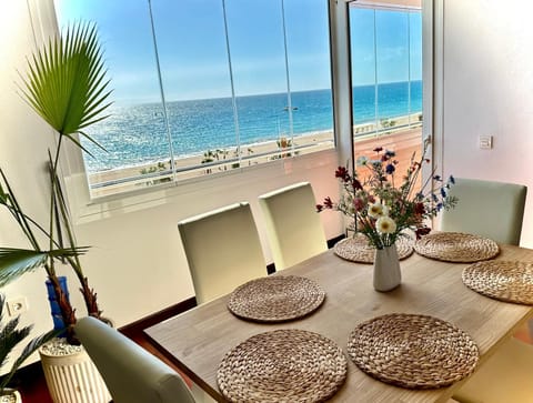 View (from property/room), Living room, Seating area, Dining area, Sea view