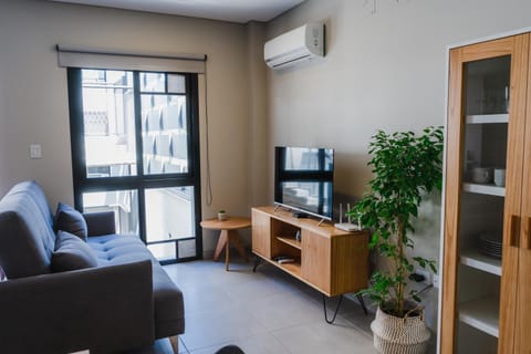 Communal lounge/ TV room, TV and multimedia, Living room, Seating area, hair dresser, air conditioner