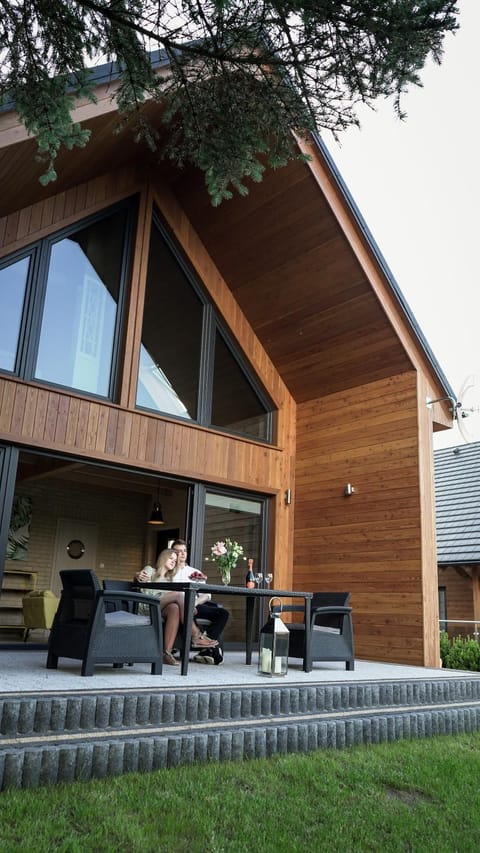 Property building, Patio, Garden, Living room, Seating area, Dining area, Garden view