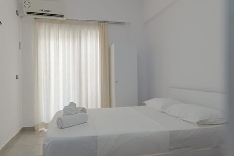 Bed, Photo of the whole room, Bedroom, towels, air conditioner