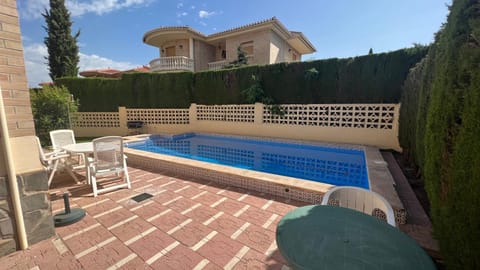Property building, Patio, Day, Natural landscape, Pool view, Swimming pool, sunbed