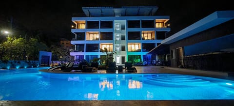 Property building, Night, Pool view, Swimming pool, sunbed