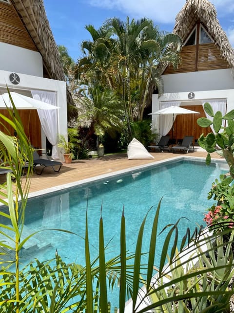 Property building, Patio, Day, Pool view, sunbed