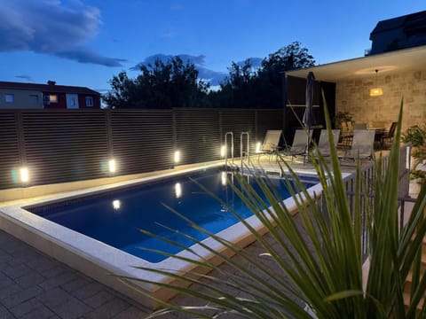 Patio, Night, Pool view, Swimming pool, sunbed